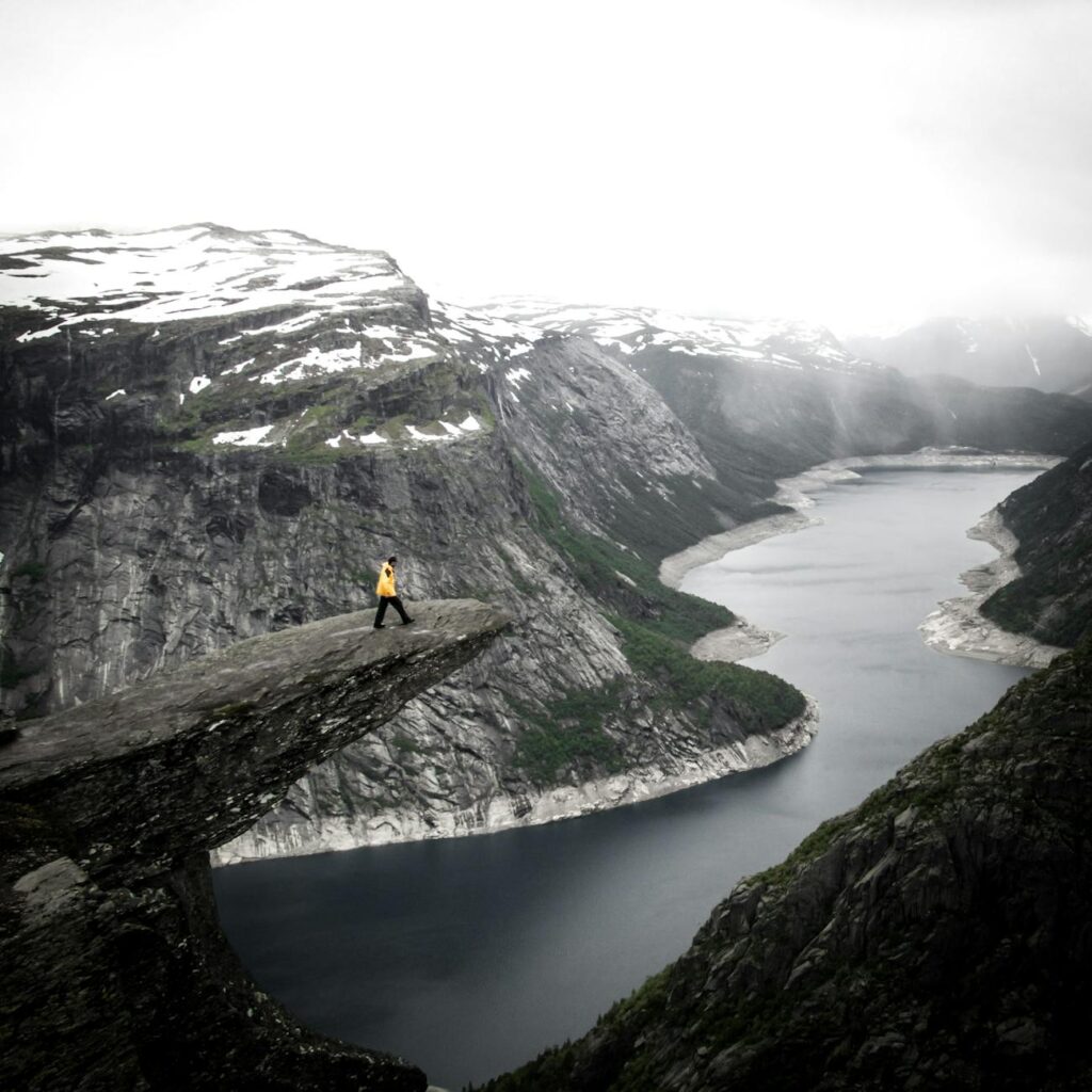 person standing on edge of cliff