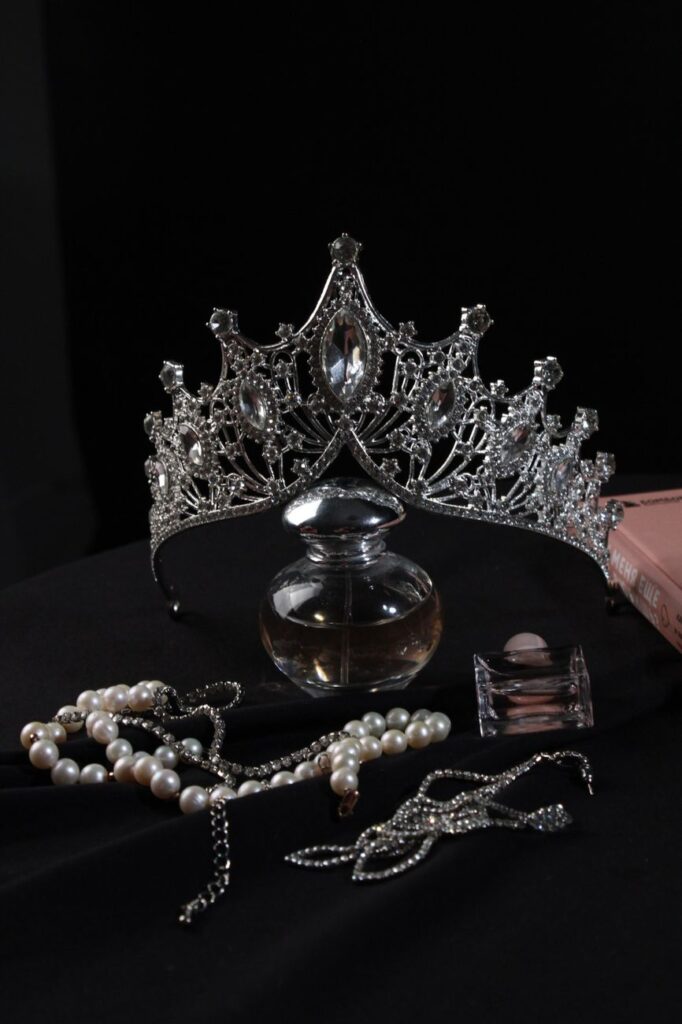 elegant silver tiara with pearls and perfume